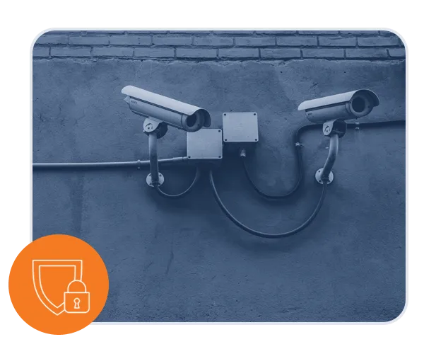 photo of security cameras on wall with lock and sheild icon overlayin gin bottom left